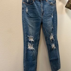 Ankle length ,destroy denim jeans. Never worn.